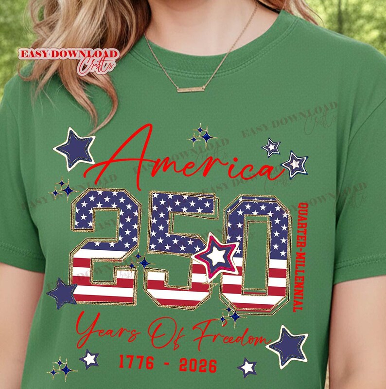May include: Green t-shirt with a patriotic design celebrating America's 250th anniversary. The design features the word "America" in red script, the number "250" in a star-spangled pattern, and the text "Years Of Freedom 1776-2026."