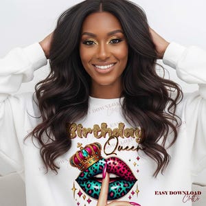 May include: A white sweatshirt featuring a graphic of a crown and lips with a leopard print design in pink and teal. The words "Birthday Queen" are in gold glitter lettering. The image also includes the text "EASY DOWNLOAD Crafts".