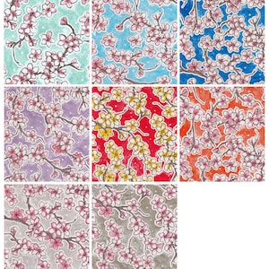 May include: A digital collage of nine different patterns featuring cherry blossoms in various colors, including pink, blue, green, yellow, red, and purple. The patterns are all on a white background.