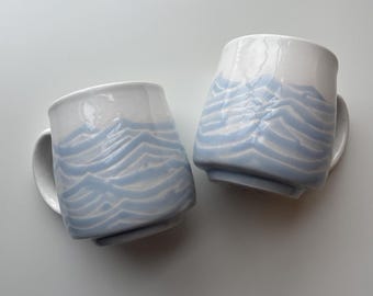 small ceramic mugs, light blue waves