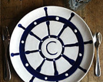 personalized ceramic serving platter, captains wheel in navy blue by Jessica Howard Ceramics