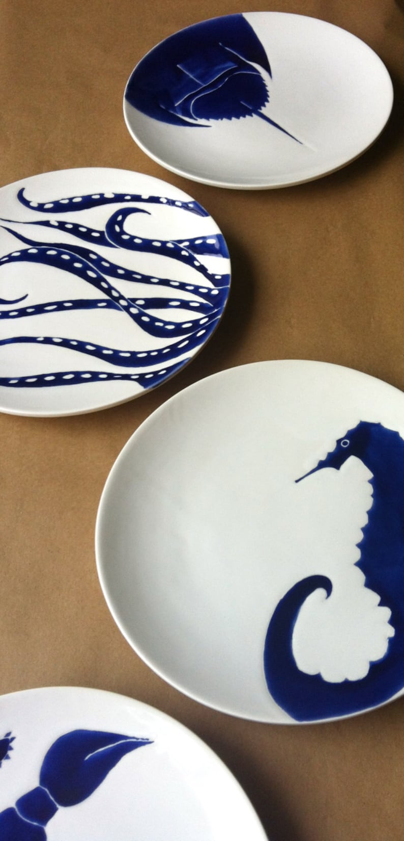 Set of 4 navy blue, nautical, beach themed ceramic dinner plates in horse shoe crab, octopus, blue crab and sea horse image 2