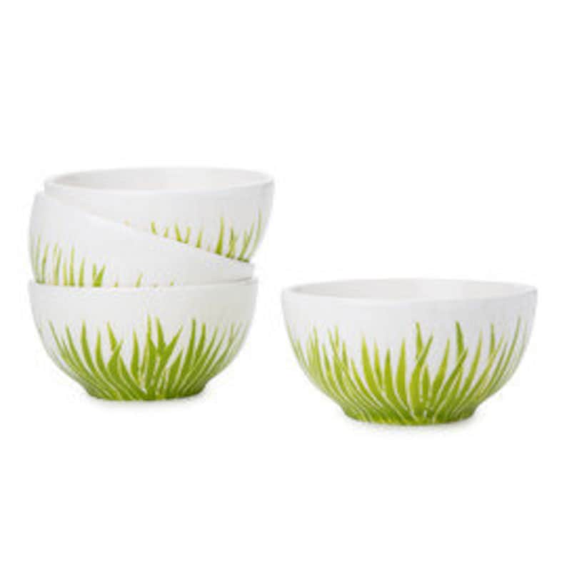 May include: Set of four white ceramic bowls with a green grass design. The bowls are small and perfect for serving snacks or dips.