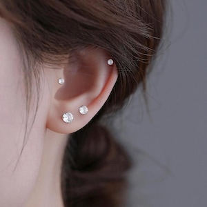 A pair of implant grade titanium earrings, 3mm, 4mm, 5mm white claw shaped earrings, minimalist earrings