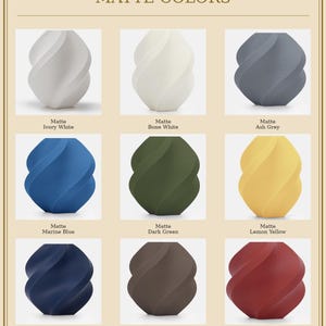 May include: A display of nine matte-finish decorative vases in various colors, including ivory white, bone white, ash grey, marine blue, dark green, lemon yellow, dark blue, dark brown, and dark red. The text "MATTE COLORS" is at the top.