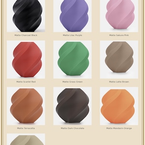 May include: A product display featuring nine matte-finish decorative vases in various colors, including black, purple, pink, red, green, brown, orange, and tan. The vases have a unique, twisted design. The text "MATTE COLORS II" is at the top.