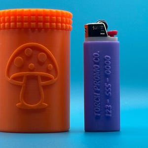 May include: An orange cylindrical container with a mushroom design and a purple lighter with the text "TORCH PROMO CO. 123 - 555 - 0000" on the side.
