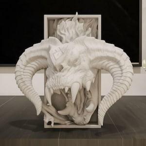 May include: A white, detailed sculpture of a horned demon skull with large teeth and a fiery mane. The sculpture is set within a rectangular frame, showcasing the intricate design and texture of the mythical creature.