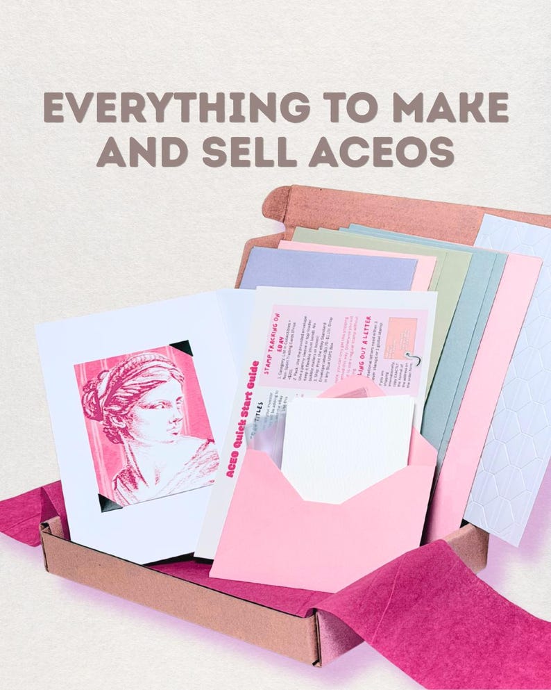 May include: A cardboard box containing art supplies for creating and selling ACEO cards. The kit includes pastel-colored cardstock, a pink envelope, and a guide titled "ACEO Quick Start Guide" featuring a pink illustration of a classical bust.