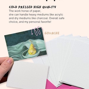 May include: Watercolor paper with the text "COLD PRESSED HIGH QUALITY". The image shows a painting of a pear on a plate, a stack of white paper, and a pink envelope. The paper is cold pressed and suitable for acrylic and charcoal.