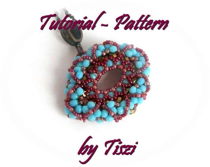 May include: A turquoise and burgundy beaded pendant with a gold accent, hanging from a brown cord. The pendant is in the shape of a circle with a hole in the center. The text "Tutorial - Pattern by Tizzi" is written in purple above the pendant.