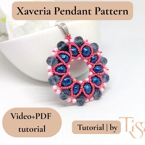 May include: A handmade pendant with a circular design. The pendant features a central ring of blue beads surrounded by pink and gray beads. The text "Xaveria Pendant Pattern" is at the top. The image also includes the text "Video+PDF tutorial" and "Tutorial | by Tiszi".