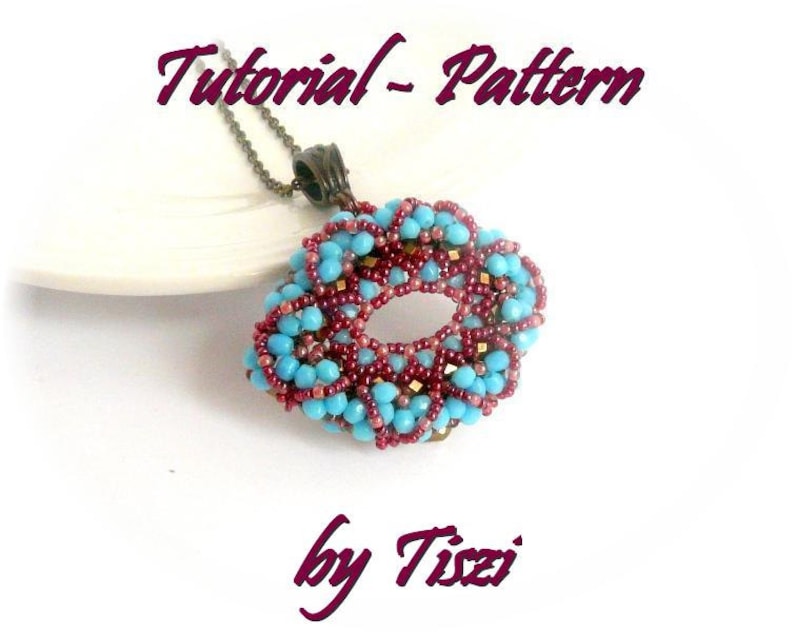 May include: A turquoise and burgundy beaded pendant with a gold accent, hanging from a silver chain. The pendant is shaped like a circle with a hole in the center. The text "Tutorial - Pattern by Tizzi" is written below the pendant.