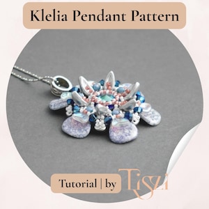 May include: A floral pendant necklace with a silver chain. The pendant has a central teal stone, surrounded by silver, blue, and pink beads. The image includes the text "Klelia Pendant Pattern" and "Tutorial | by Tisza".