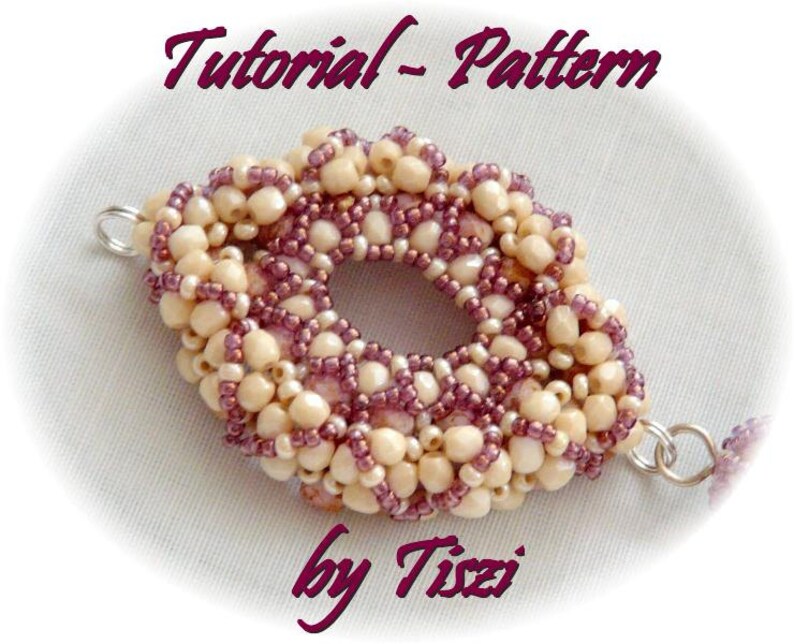 May include: A close-up of a beaded jewelry pattern tutorial by Tizzi. The pattern is made with small, white and purple beads, and is shaped like a flower.
