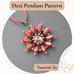 May include: A handcrafted pendant necklace with a starburst design. The pendant features coral, black, and clear beads, with a central crystal. The necklace has a pink cord and a silver-toned clasp. Text on the image reads "Dezi Pendant Pattern" and "Tutorial by Tiszi".
