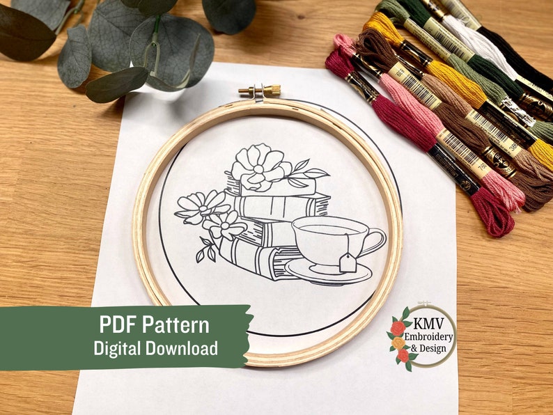 May include: A black and white line drawing of a stack of books with a cup of tea and flowers. The drawing is in a wooden embroidery hoop. The text "PDF Pattern Digital Download" is at the bottom of the image. The text "KMV Embroidery & Design" is at the bottom right of the image.