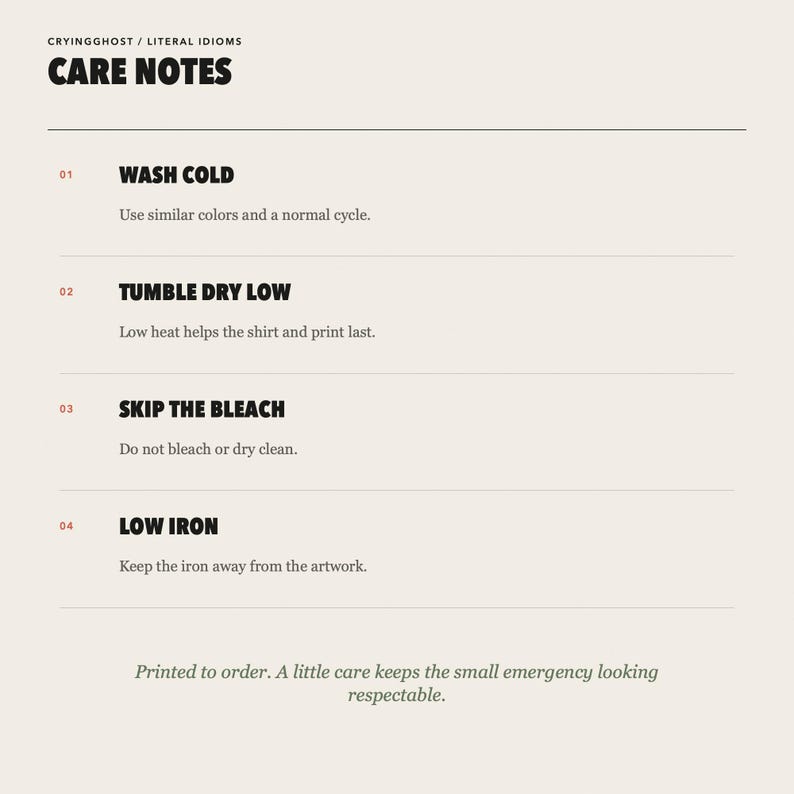 May include: A white informational card titled CARE NOTES by CRYINGGHOST / LITERAL IDIOMS. It lists four garment care instructions: WASH COLD, TUMBLE DRY LOW, SKIP THE BLEACH, and LOW IRON, each with specific sub-text instructions and a final note.