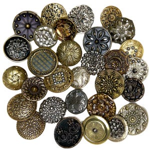 May include: A collection of assorted round metal buttons featuring various intricate embossed patterns, floral motifs, geometric textures, and metallic finishes in shades of gold, silver, bronze, copper, and dark gunmetal gray arranged together.