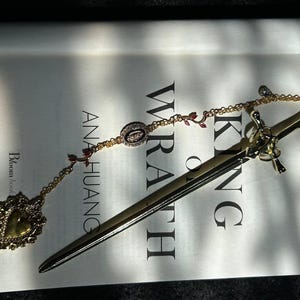 Gold fantasy sword bookmark with charms