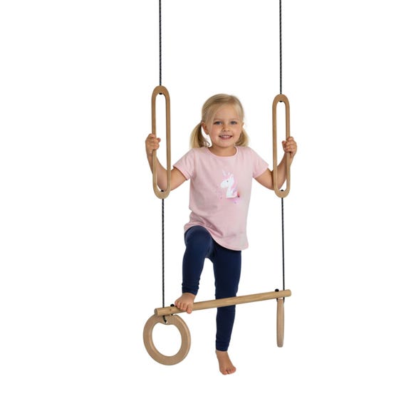 Trapezoid with eyelets at the top and bottom. A trapeze on which you can swing while standing, indoor trapeze, gymnastic toy, home trapeze.