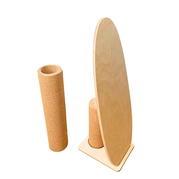 Balance board. A stable balance board. Balance boards including cork roll and stand. Cork roll and balance board mat made of cork.