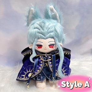 May include: A plush doll with light blue hair and red eyes, dressed in a dark blue cape with gold embroidery. The doll has a distinctive design. The text "Style A" is visible in the lower right corner.