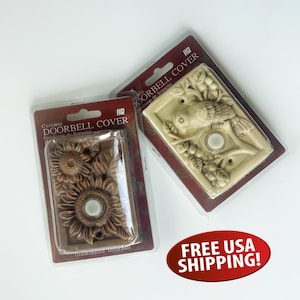 May include: Two ceramic doorbell covers in packaging. One features a sunflower design, the other a bird on a branch. Both have a white doorbell button. The packaging reads "Ceramic Doorbell Cover".