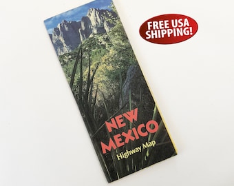 May include: A vintage New Mexico highway map with a mountain range and green foliage on the cover. The text "NEW MEXICO Highway Map" is printed in red on the cover.