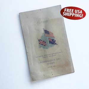 May include: Vintage menu from U.S. Naval Receiving Barracks No. 3, Auckland, New Zealand. The cover features the text "Menu" in script, along with illustrations of the American, British, and New Zealand flags. The menu is for an Independence Day dinner on July 4th, 1940.