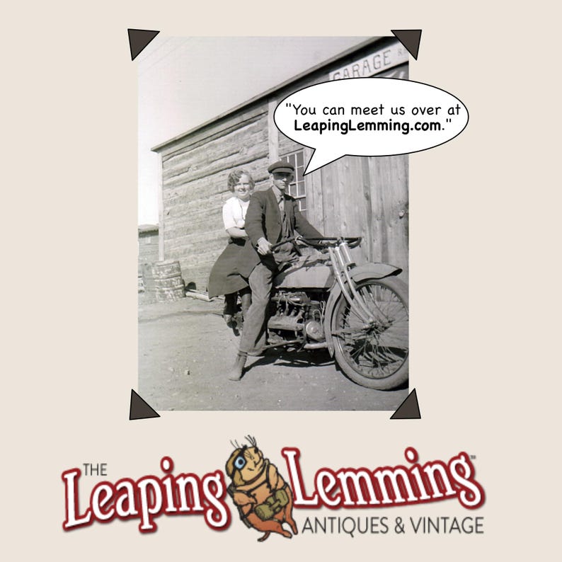 May include: Vintage black and white photograph of a man and woman on a motorcycle. The image includes the text "You can meet us over at LeapingLemming.com." and the logo for "The Leaping Lemming Antiques & Vintage".