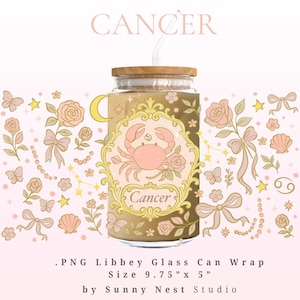 May include: A glass can wrap with a pink crab illustration, the word "Cancer", and floral accents. The design includes a wooden lid and a straw. The wrap is 24.77 cm by 12.7 cm.