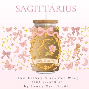 May include: A Libbey glass can wrap with a Sagittarius theme. The design includes a gold frame with a bow and arrow, pink bows, butterflies, and constellations. The text "SAGITTARIUS" is at the top. The wrap measures 24.77 cm x 12.7 cm.