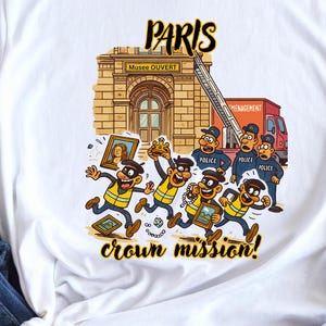 May include: White t-shirt with a cartoon illustration of a building and the text "PARIS" and "crown mission!". The graphic shows cartoon characters fleeing from police officers.