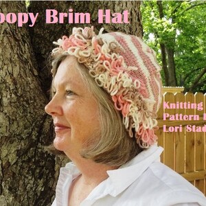 May include: A woman wearing a pink and white striped knit hat with a loopy, crocheted brim. The hat is made with a combination of pink, white, and brown yarn. The text "Loopy Brim Hat" and "Knitting Pattern by Lori Stade" is visible in the image.