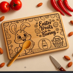 Peut inclure: Planche à découper rectangulaire en bois avec un dessin de lapin et le texte "Easter Treats for the Bunny". Une cuillère en bois et un couteau sont présents. Des tomates, des amandes et des piments rouges entourent la planche.