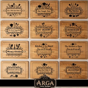 May include: A selection of rectangular wooden chopping boards with engraved kitchen-themed phrases and decorative elements. Each board features a different quote, such as "Life is What You Bake It" and "Kitchen Rules: Eat, Laugh, Love". The boards are light brown with dark brown engraved designs.