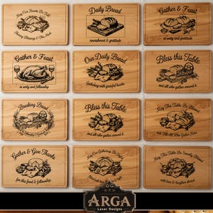 May include: A selection of wooden chopping boards with engraved designs and text. Each board features a different phrase related to food and gatherings, such as "Daily Bread" and "Gather & Feast". The boards are made of light-coloured wood.