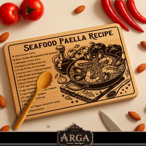 May include: A wooden chopping board featuring the text "SEAFOOD PAELLA RECIPE" and a detailed illustration of a paella dish. The board includes a list of ingredients. A wooden spoon and a knife are also present.