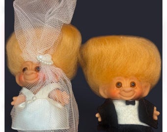 Vintage 1960s Dam Things original troll dolls wedding set featuring a bride and groom.