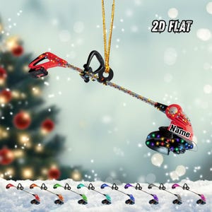 May include: A red and black weed wacker Christmas ornament with a string of lights. The ornament has the text "Name" on the side. The image also shows a variety of other colored weed wacker ornaments.