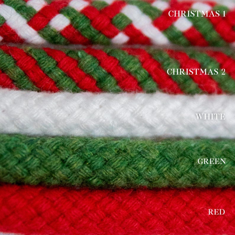 May include: Close-up of six braided ropes in various colours. The top two ropes are Christmas-themed, with red, green, and white patterns. The other ropes are white, green, and red. Text labels identify each colour.