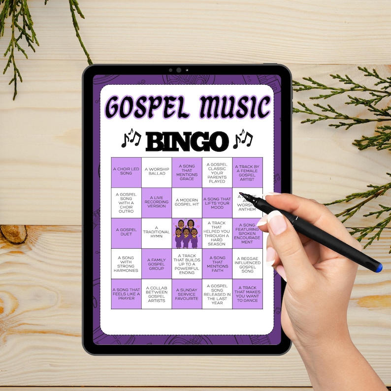 May include: A digital tablet displaying a purple and white "GOSPEL MUSIC BINGO" game. The game board features various gospel music-related prompts. A hand holding a black pen is pointing at the board.