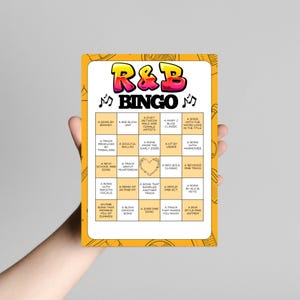 Puede incluir: Una tarjeta rectangular del juego de Bingo R&B con un borde amarillo y un interior blanco. La parte superior de la tarjeta presenta las palabras "R&B BINGO" en letras coloridas. La tarjeta est&aacute; dividida en cuadrados con indicaciones tem&aacute;ticas de R&B.
