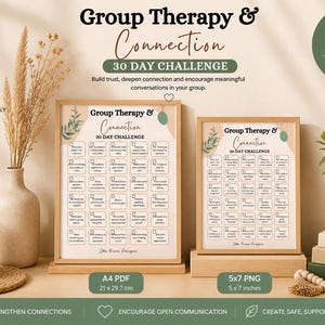 May include: Two framed prints with the text "Group Therapy & Connection 30 Day Challenge" are displayed. The frames are light brown. The image includes a vase with dried flowers, a candle, and a small plant. The A4 PDF is 21 x 29.7 cm and the 5x7 PNG is 5 x 7 inches.