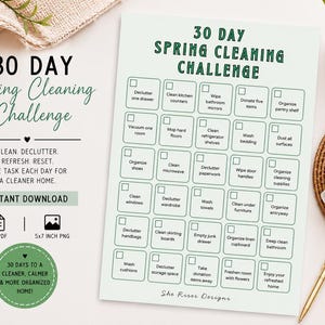 May include: A 30 Day Spring Cleaning Challenge checklist printed on a light green sheet. The document features a grid of thirty tasks with checkboxes, including decluttering, cleaning, and organizing activities, with the title at the top.