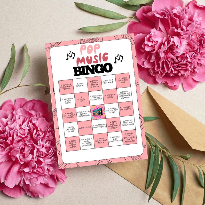 May include: A pink Pop Music Bingo game card with musical notes and a retro boombox graphic. The card features various bingo squares with pop music-related phrases. The card is surrounded by pink flowers and a brown envelope.