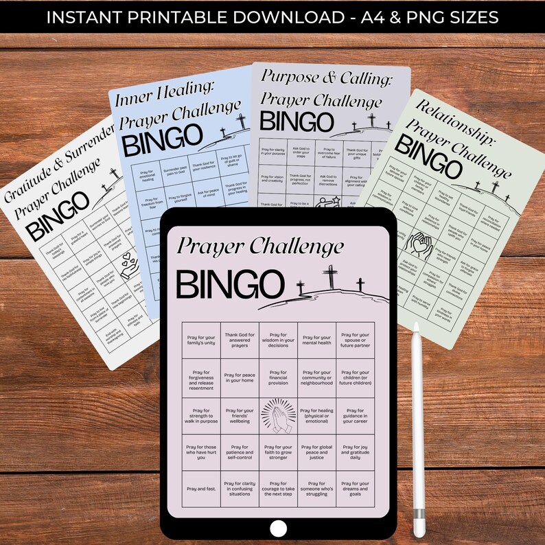 May include: A digital download featuring a Prayer Challenge Bingo game. The image shows a tablet displaying the game, surrounded by printed bingo cards with titles like "Gratitude & Surrender" and "Inner Healing." A white stylus rests nearby. The text "INSTANT PRINTABLE DOWNLOAD" is at the top.