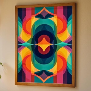 May include: A framed abstract art print with a vibrant, colourful design. The artwork features a symmetrical arrangement of geometric shapes in shades of blue, green, orange, yellow, pink, and purple. The print is encased in a natural wood frame.