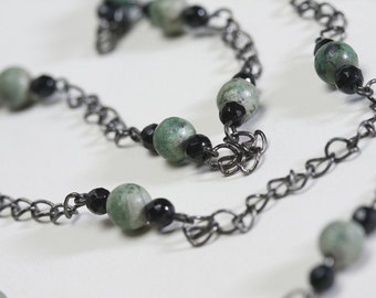 Blue green organic stone and black onyx layered necklace. African turquoise represents evolution, bringing change & transformation in life.